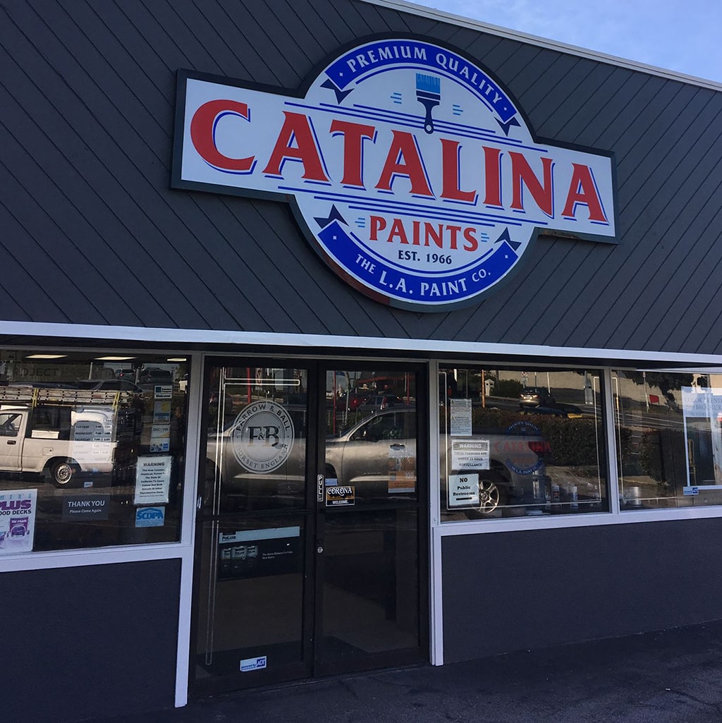 Catalina Paints store front; dark gray building with large Catalina Paints logo